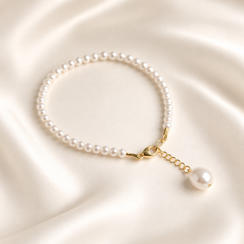 Céline Bridal Pearl Bracelet on warm ivory-beige background
