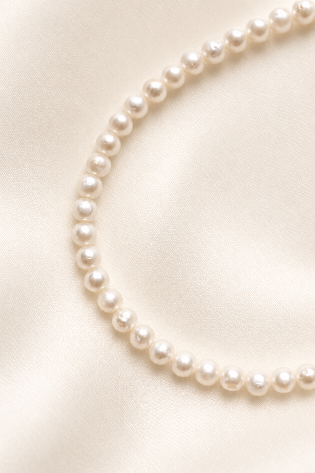 Céline Bridal Pearl Bracelet on warm ivory-beige background