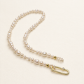 Chiara Classic Pearl Necklace on warm ivory-beige background