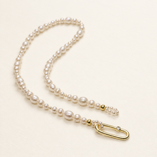 Chiara Classic Pearl Necklace on warm ivory-beige background