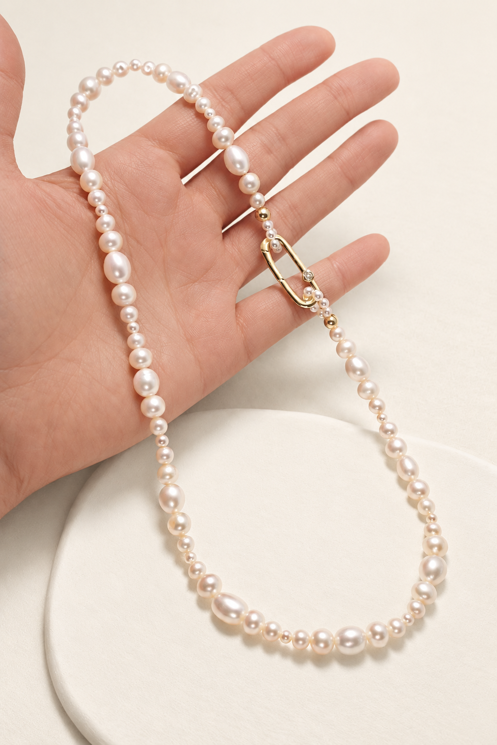 Chiara Classic Pearl Necklace on warm ivory-beige background