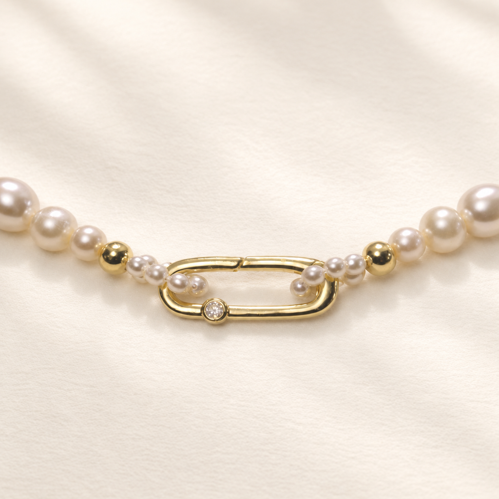 Chiara Classic Pearl Necklace on warm ivory-beige background