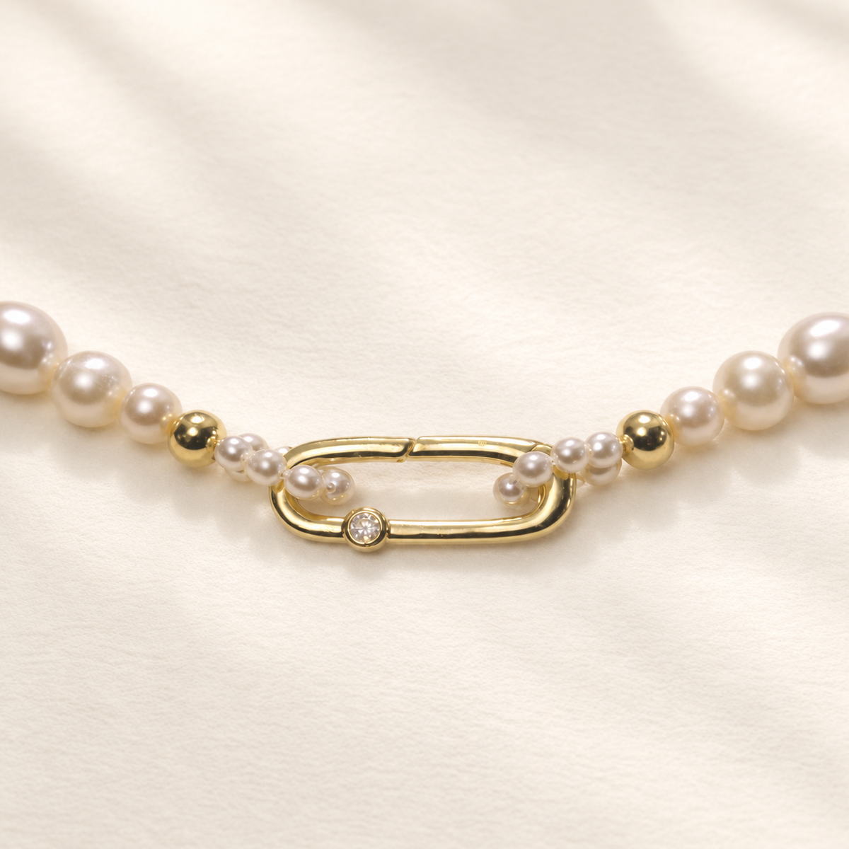 Chiara Classic Pearl Necklace on warm ivory-beige background