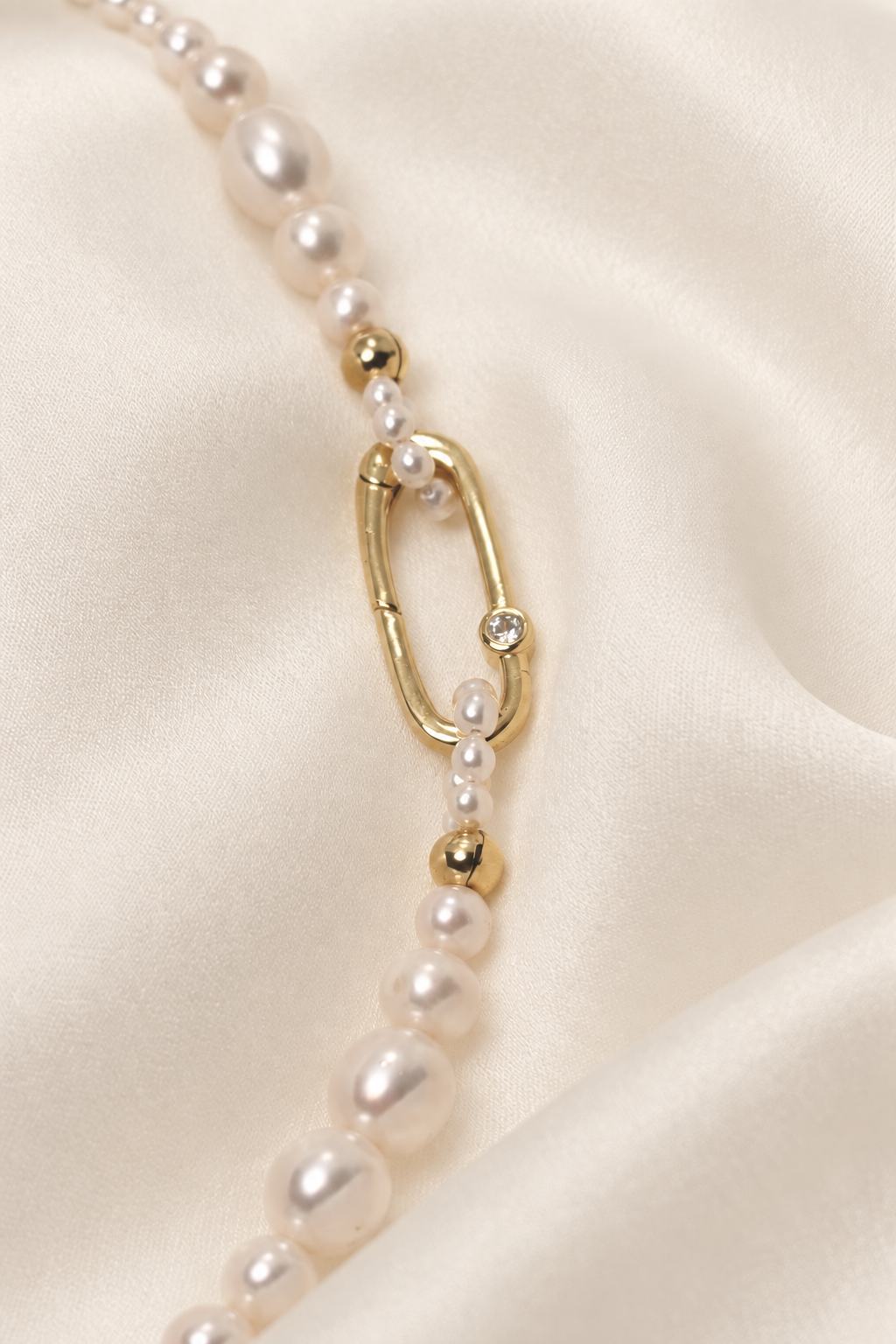 Chiara Classic Pearl Necklace on warm ivory-beige background